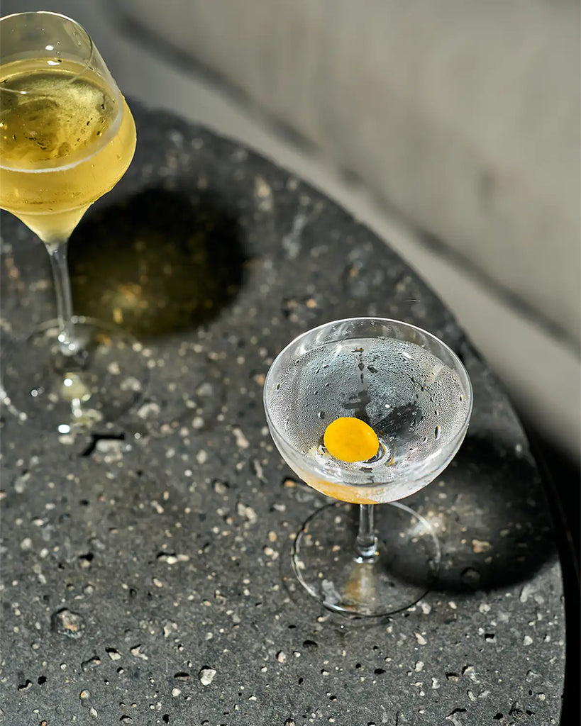 Naked vodka Martini served in a chilled martini glass garnished with lemon peel, simple sugar free vodka cocktails
