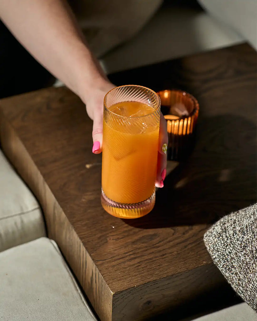 Carrot Sling served in a highball glass, highball vodka cocktail recipes, autumnal cocktails